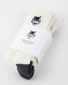 A three-pack of white Wolfe socks with a drawing of a wolf on each