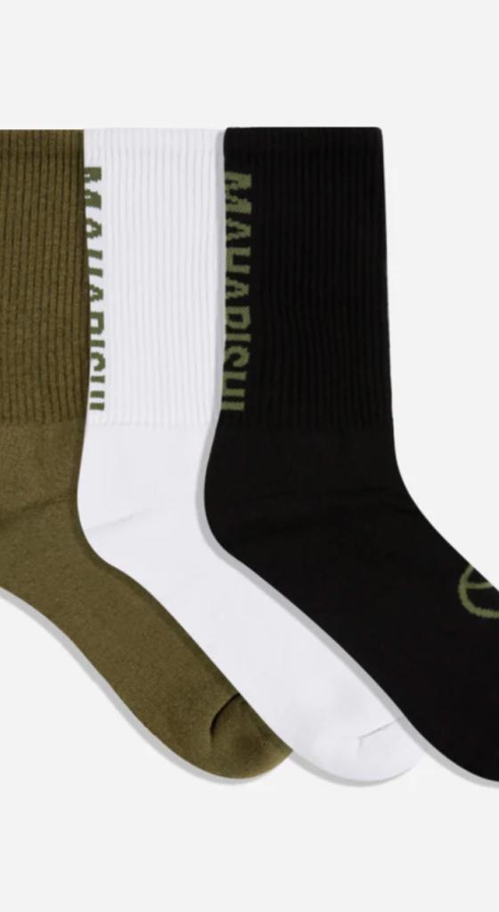 Green, white and blacks Marahishi crew socks on a white background