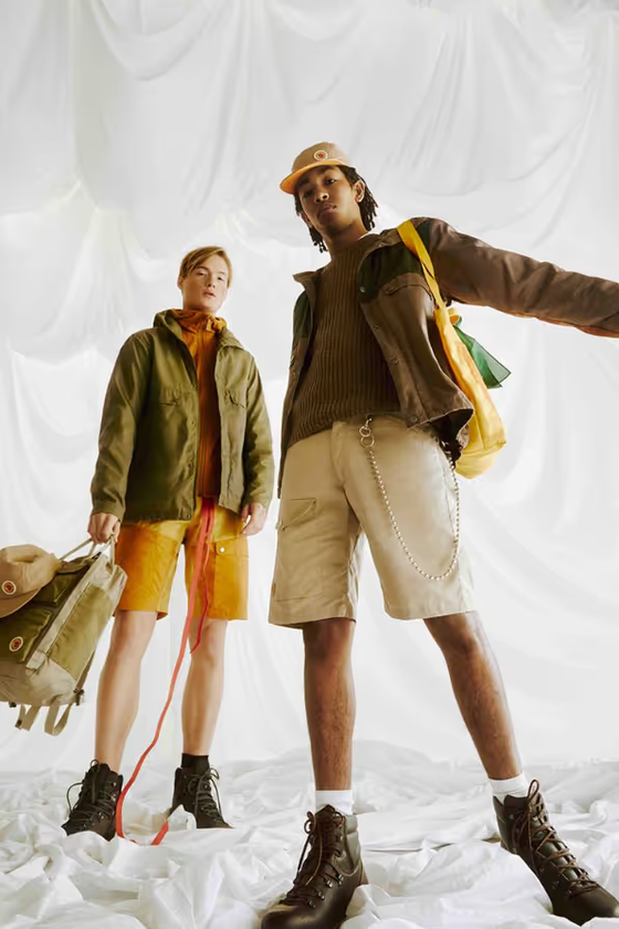 Two people together wearing brown Fjallraven clothing and gear