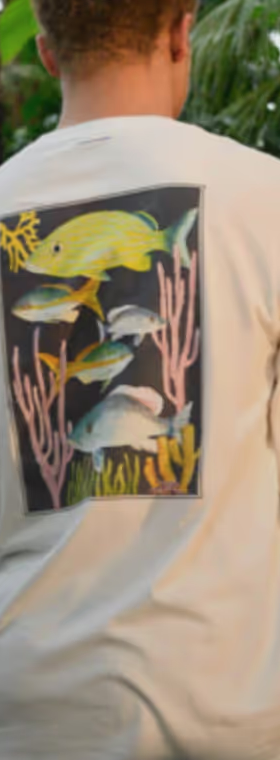 Man in nature wearing white long-sleeve Tentree T-shirt with a Fish print on the back