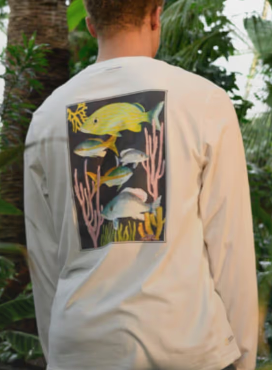 Man in nature wearing white long-sleeve Tentree T-shirt with a Fish print on the back