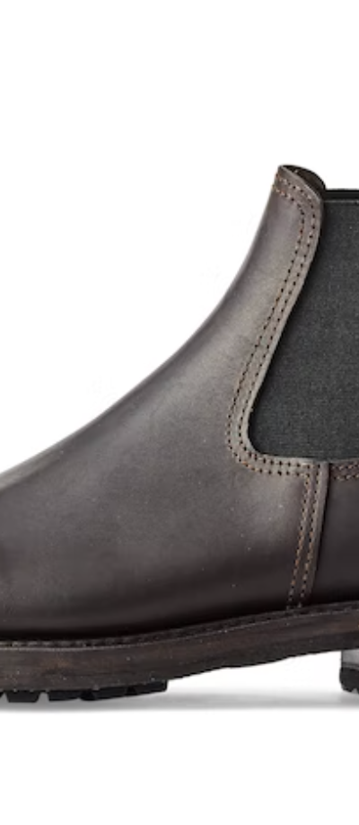 A black pair of contemporary Filson black boots on a white background