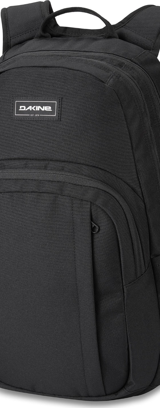 A black Dakine backpack on a white backdrop