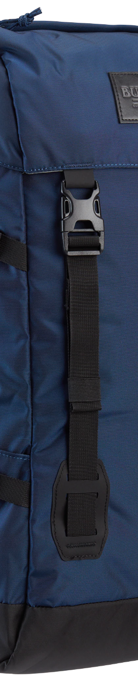 A navy blue Burton rucksack backpack on a white background