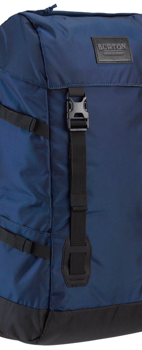 A navy blue Burton rucksack backpack on a white background
