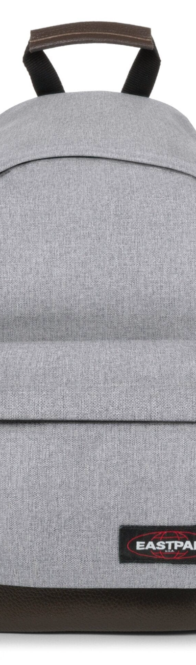 A grey Eastpak backpack on a white background