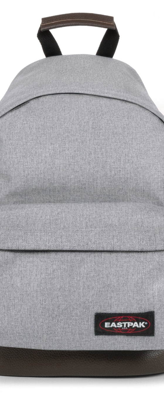 A grey Eastpak backpack on a white background
