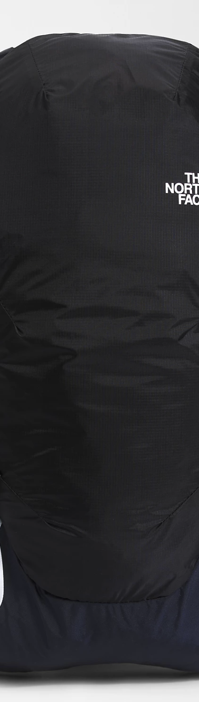 A black North Face travel bag on a white background