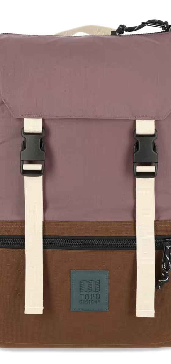 A brown and light purple rucksack backpack from Topo Designs on a white background