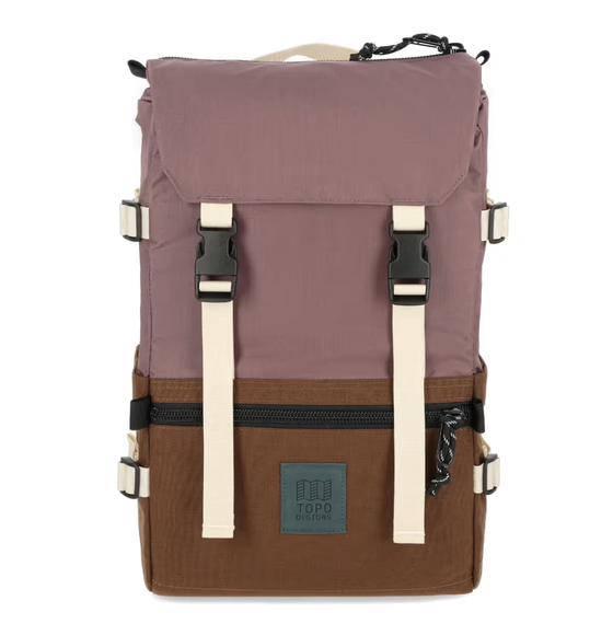 A brown and light purple rucksack backpack from Topo Designs on a white background