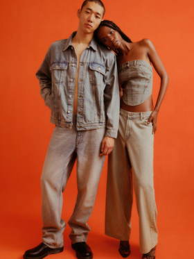 A couple wearing a Topman jean jacket and matching denim pants along with black loafers