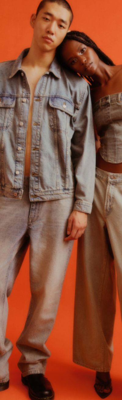 A couple wearing a Topman jean jacket and matching denim pants along with black loafers