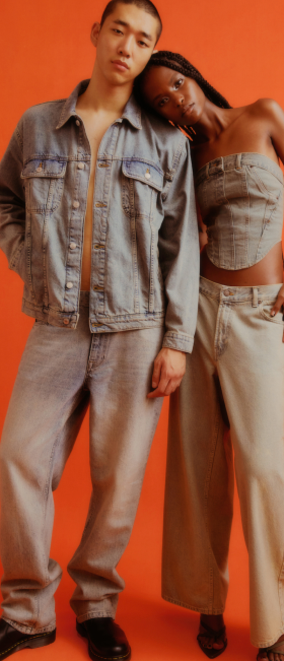 A couple wearing a Topman jean jacket and matching denim pants along with black loafers