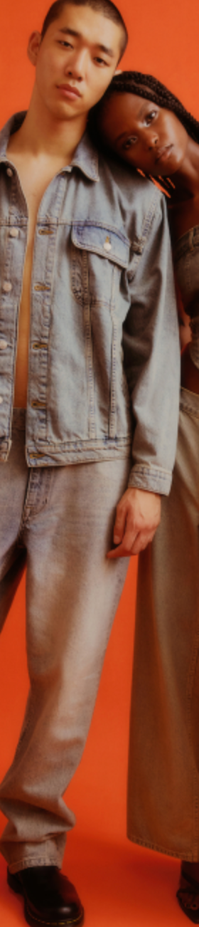 A couple wearing a Topman jean jacket and matching denim pants along with black loafers