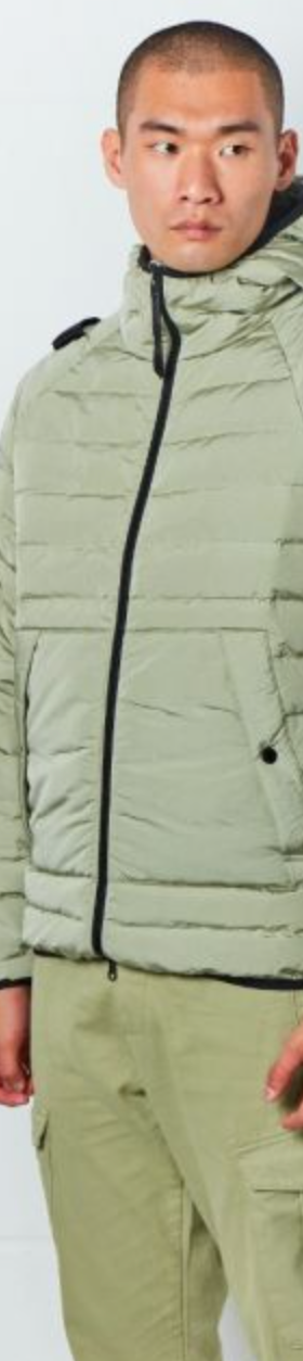 A man wearing a mint green MA.Strum technical jacket and matching pants