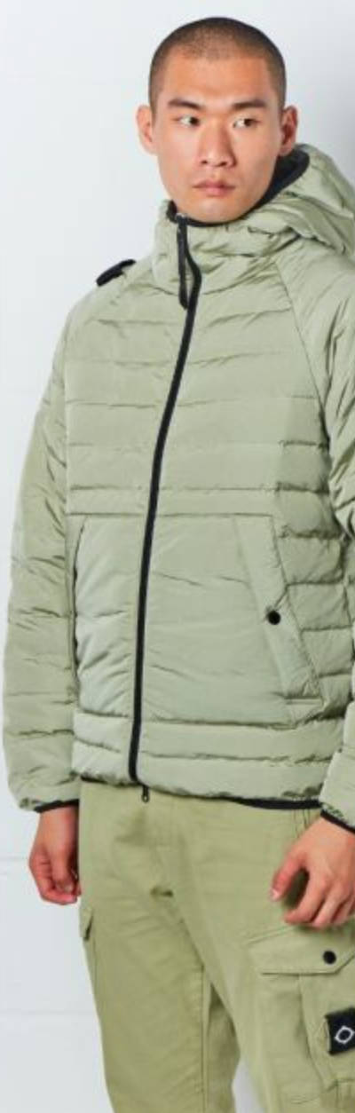 A man wearing a mint green MA.Strum technical jacket and matching pants