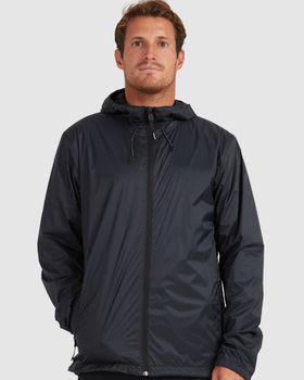 A man wearing a dark navy blue Quiksilver raincoat