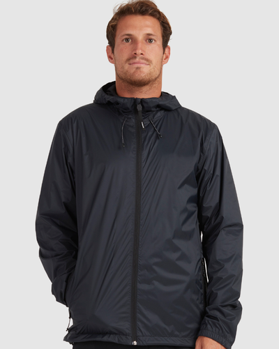 A man wearing a dark navy blue Quiksilver raincoat