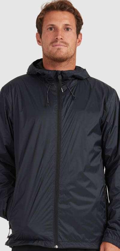 A man wearing a dark navy blue Quiksilver raincoat