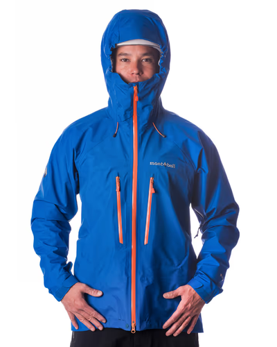 A man wearing a blue Monbell Winter jacket with the hood on