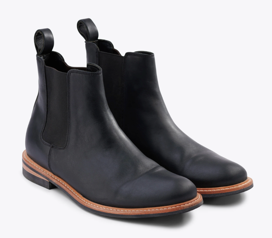 A black pair of Nisolo slip-on boots