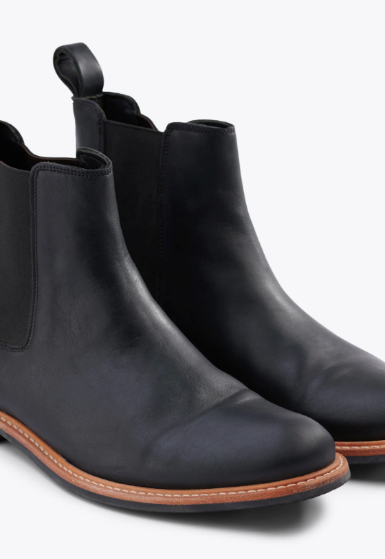 A black pair of Nisolo slip-on boots