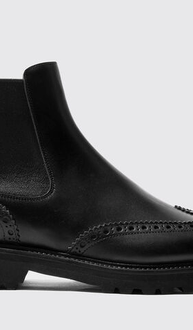 A black pair of high-end Scarosso slip-on boots