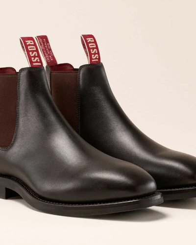 A pair of brown leather Rossi slip-on boots