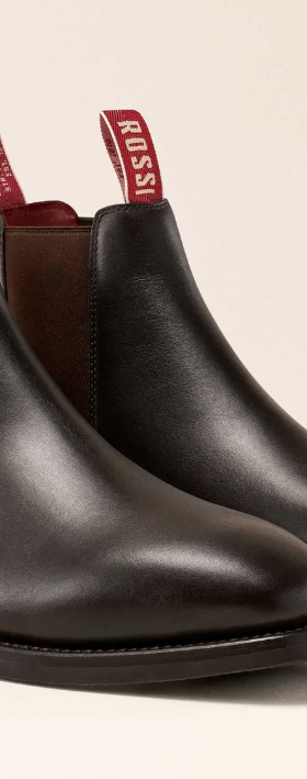 A pair of brown leather Rossi slip-on boots