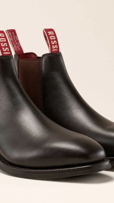 A pair of brown leather Rossi slip-on boots