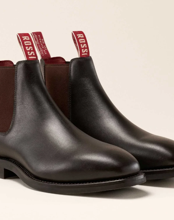 A pair of brown leather Rossi slip-on boots