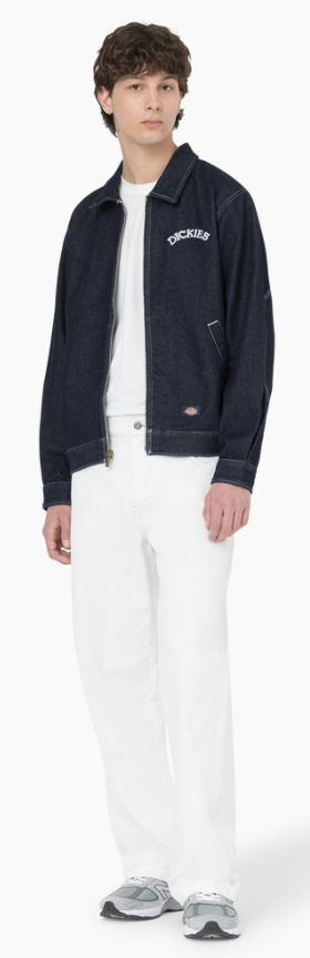 A man wearing denim dickies jacket and white workwear pants