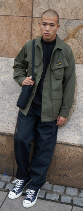 A man wearing a Stan Ray workwear button up and navy blue pants
