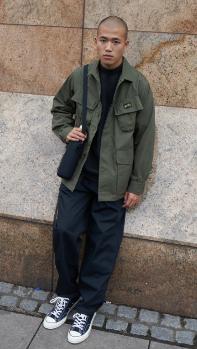 A man wearing a Stan Ray workwear button up and navy blue pants