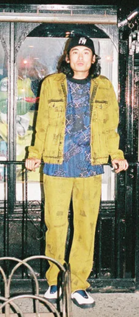 A man wearing a yellow fucking awesome jacket with matching pants
