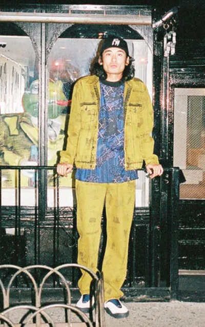 A man wearing a yellow fucking awesome jacket with matching pants