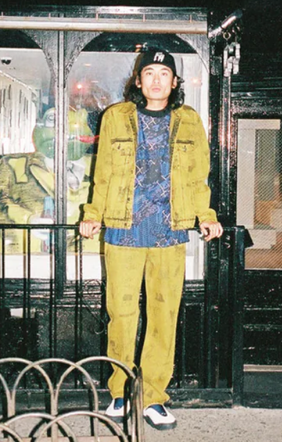 A man wearing a yellow fucking awesome jacket with matching pants