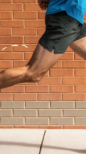 A man running in Brooks sneakers