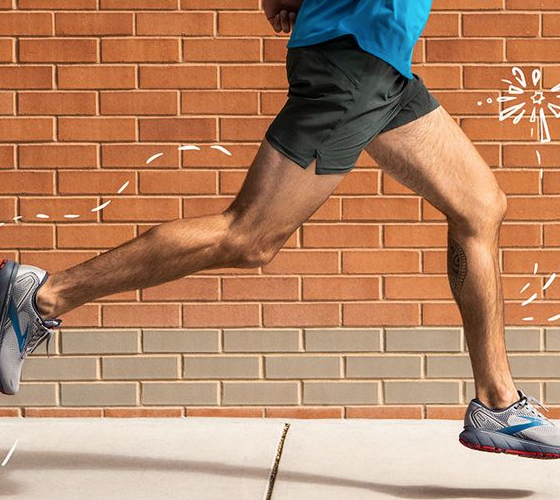 A man running in Brooks sneakers
