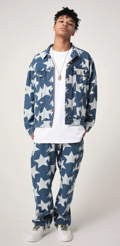 A man wearing a denim BAPE outfit with an all-over star print and a white t-shirt