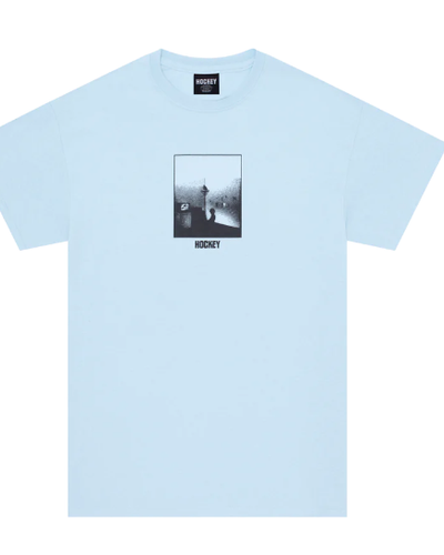 A baby blue Hockey Skateboards t-shirt with a logo and minimalist print