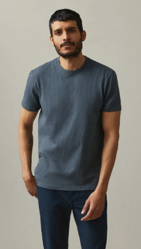 A man wearing a navy blue American Giant blank t-shirt