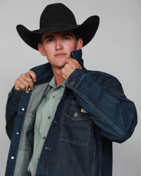 A man wearing a cowboy hat along with a denim Kimes Ranch jacket