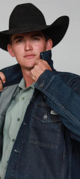 A man wearing a cowboy hat along with a denim Kimes Ranch jacket