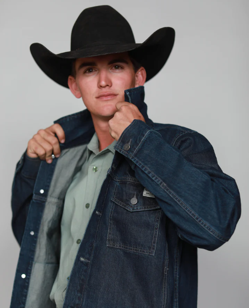 A man wearing a cowboy hat along with a denim Kimes Ranch jacket