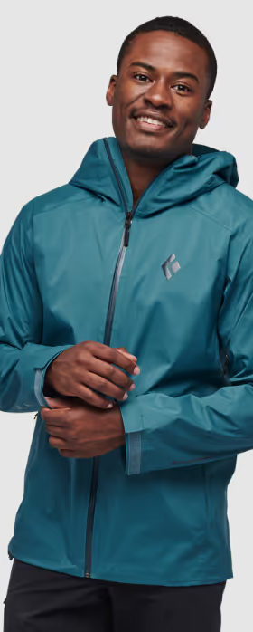 A man wearing a sleek Black Diamond blue windbreaker jacket