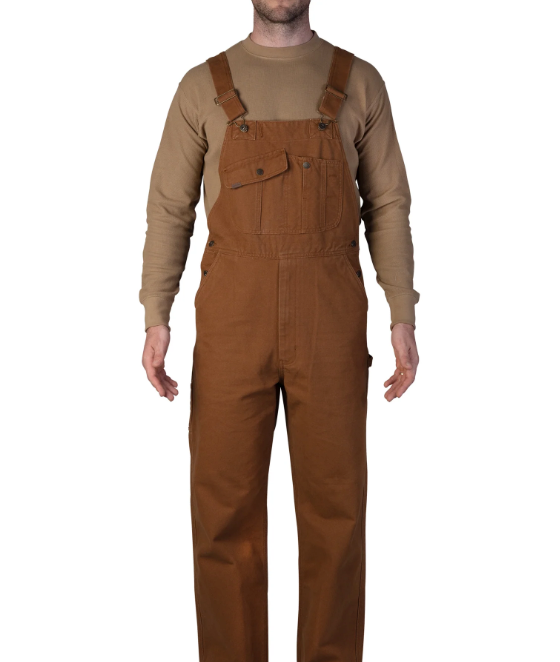 A man wearing a brown workwear overalls by Smith's