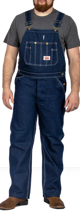 A man wearing class denim overalls from Round House