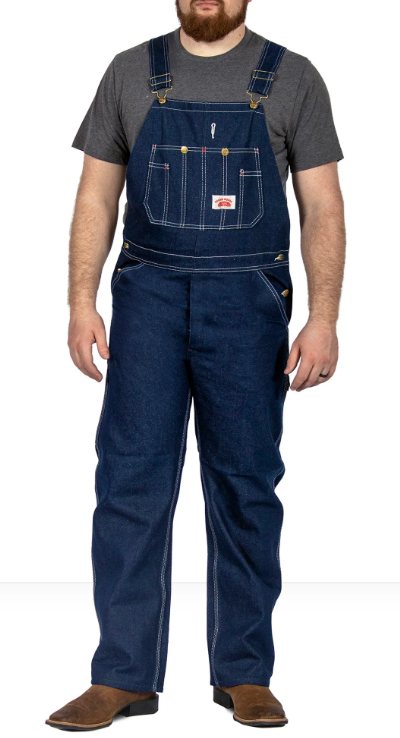 A man wearing class denim overalls from Round House