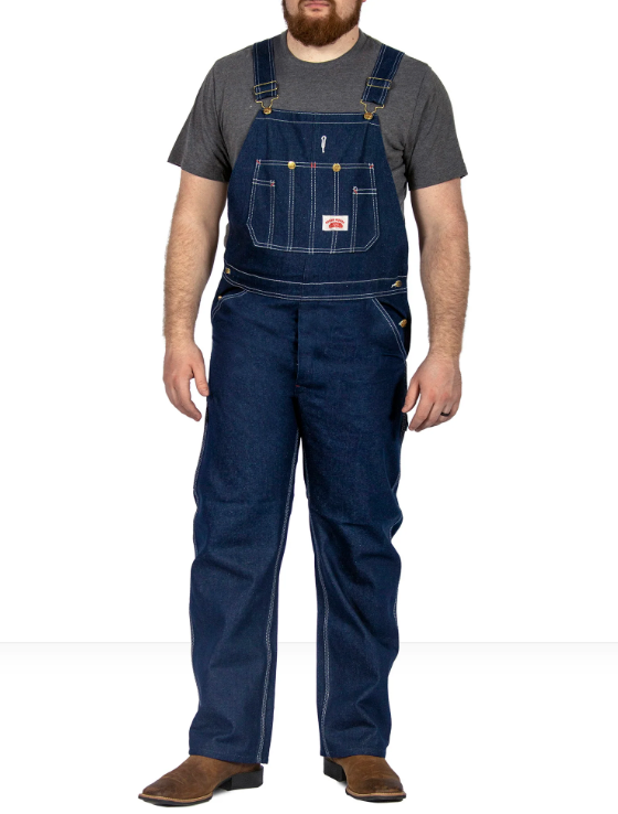 A man wearing class denim overalls from Round House